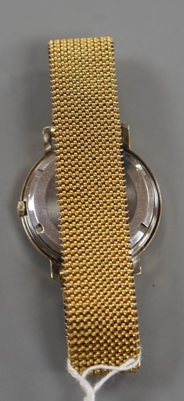 A gentleman's steel and gold plated Omega Constellation automatic wrist watch, on associated flexible strap, case diameter 35mm.